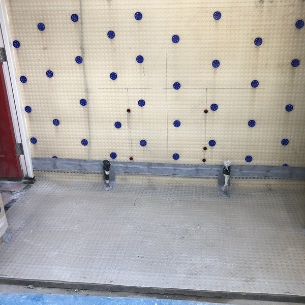 Cavity drain membrane to walls and floor
